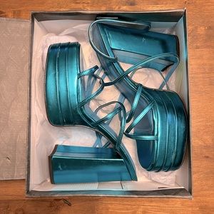 Brand new never worn blue strap platform heels size 10